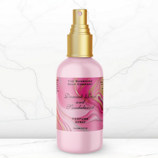 Perfume spray bottle with pink label on a white background